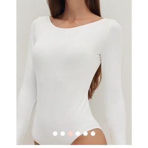 Beautiful bodysuit brand new with tags.